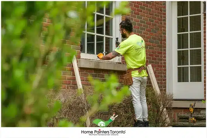 Painter Repairing Window