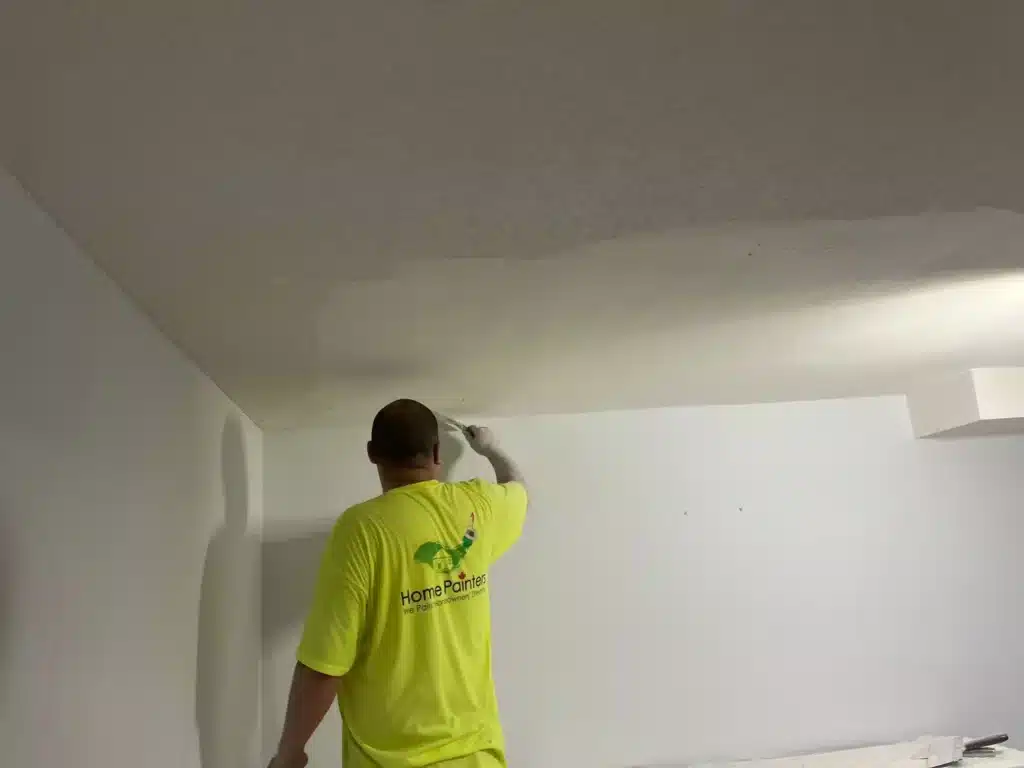 Painter Flattening the Stucco Ceiling