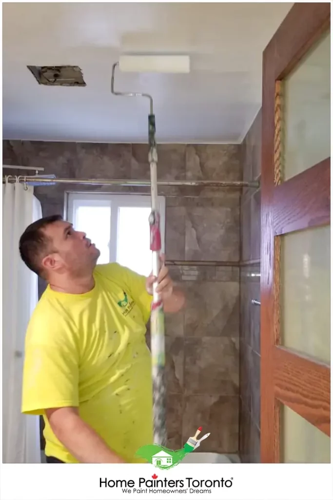 Painter Painting Bathroom Ceiling