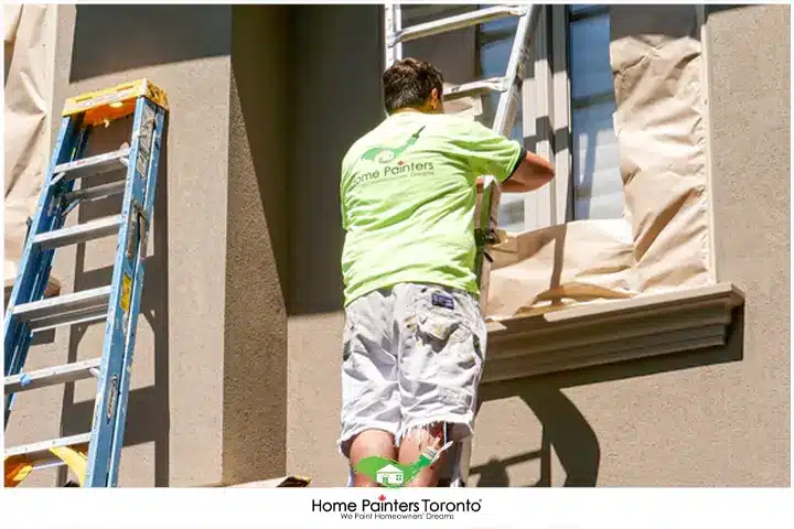 Painter Painting Stucco with Cover