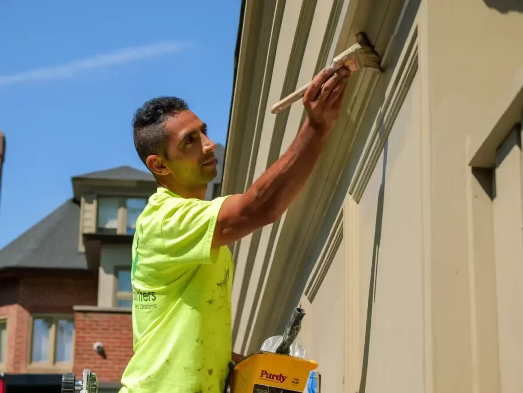 Painter Painting Exterior At Richmond