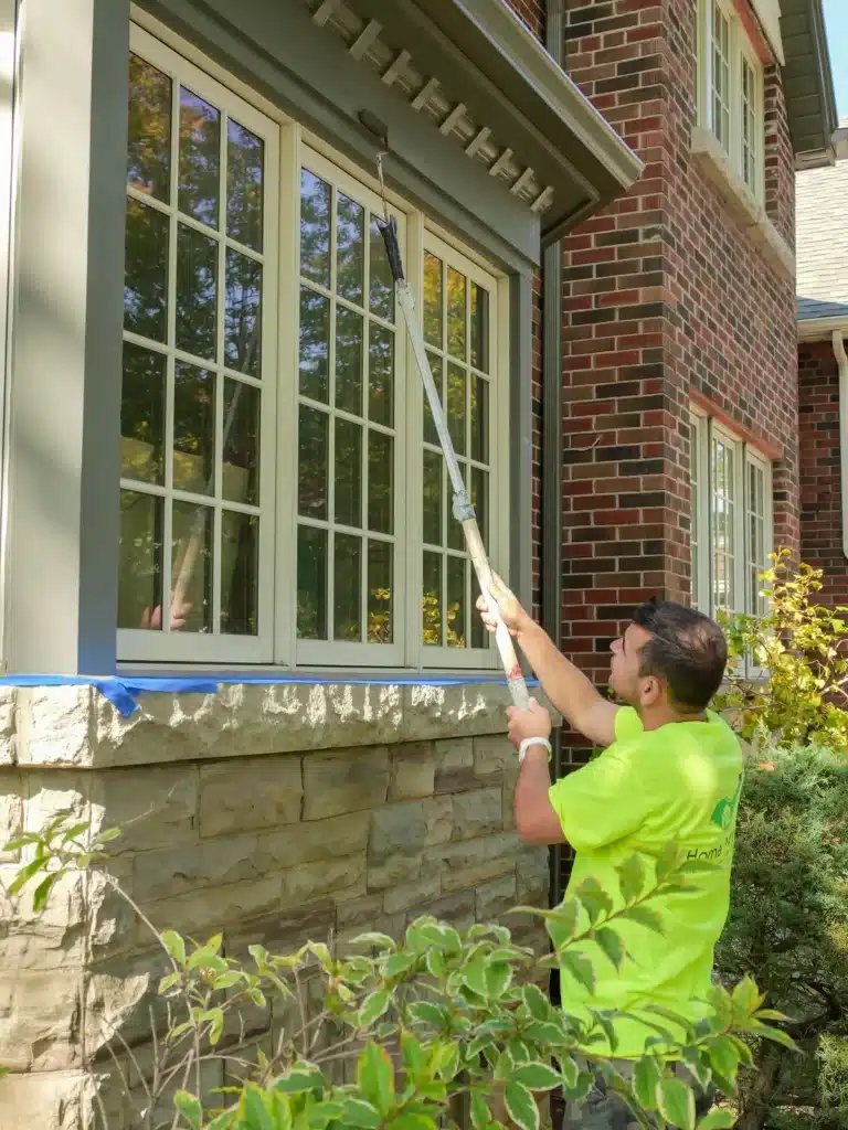 Painter Painting Exterior Window