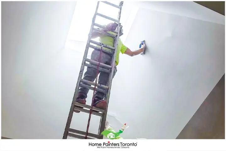 Painter Painting with Ladder
