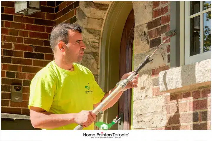 Painter Painting Wooden Trim Windows