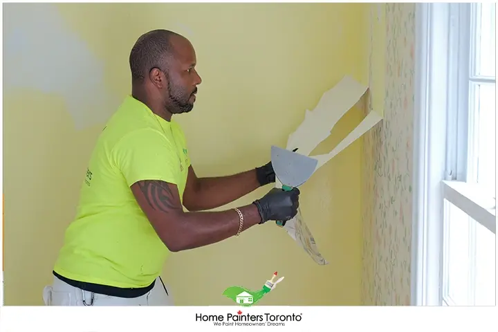 Painter Removing Wallpaper