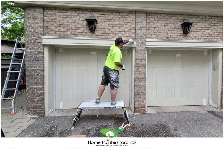 Painter Repairing The Garage Walls