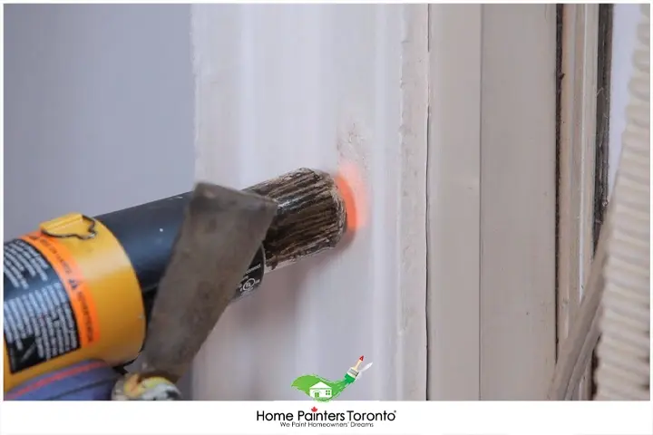 painter_stripping_with_heat_gun