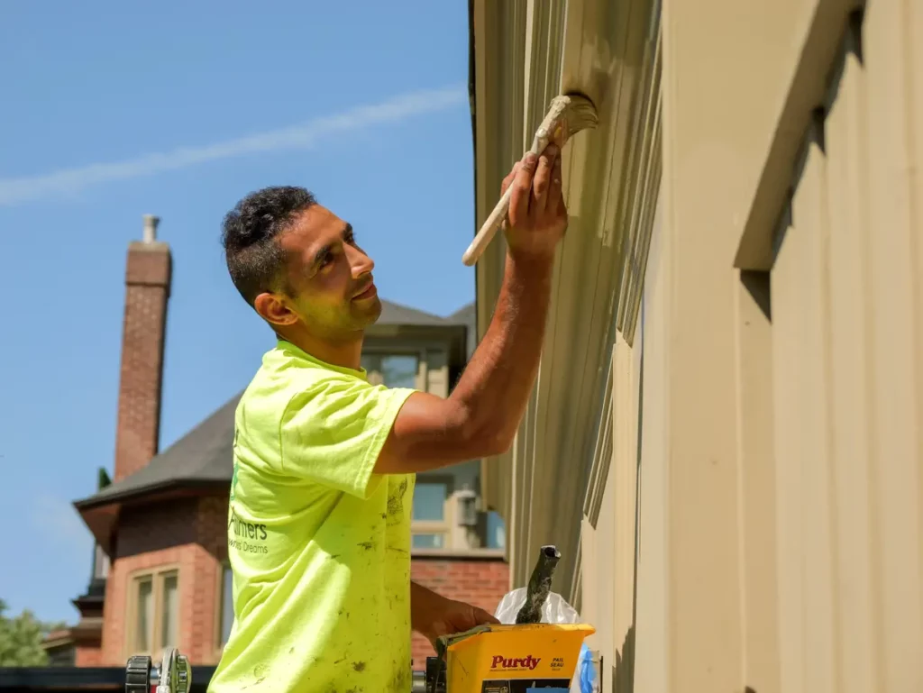 Painter Using Ladder