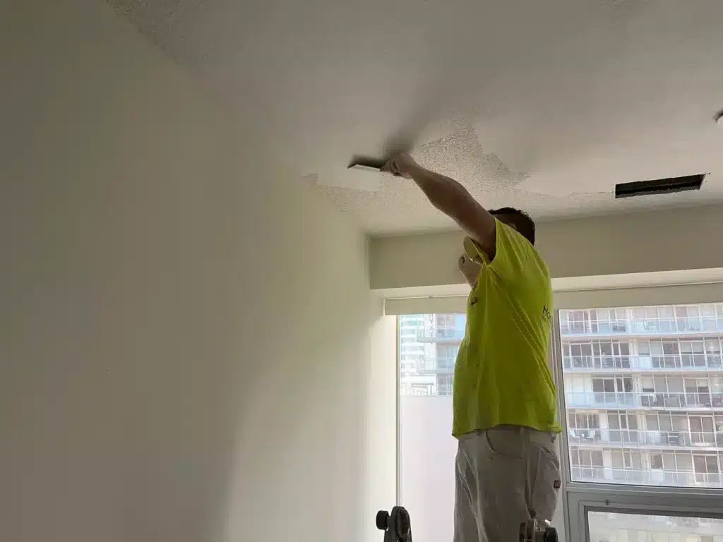 Painters Flattening Stucco Ceiling