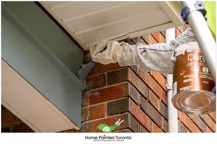 Painters Painting Exterior Wooden Trim