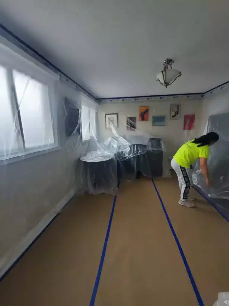 Painters Preparing Room Using Tape