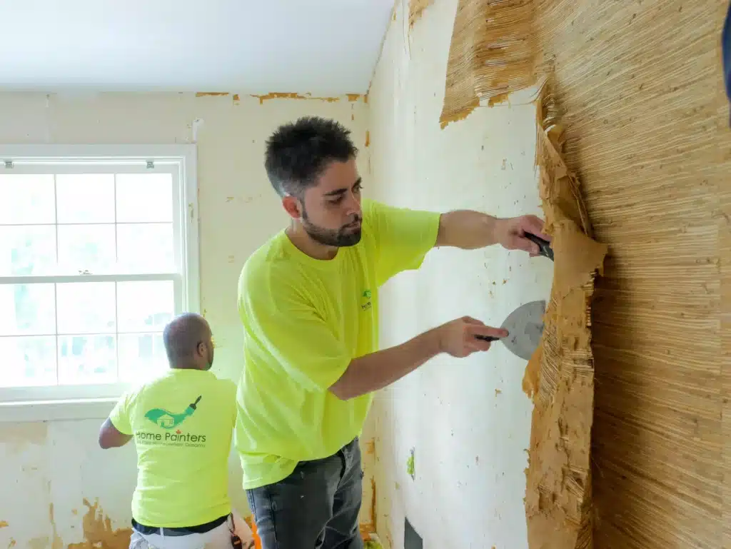 Painters Scraping Off Wallpaper