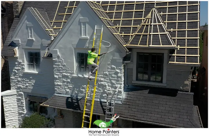 Painter Spraying Brick