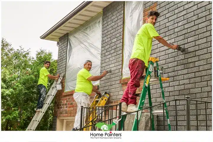 Painter Staining Brick