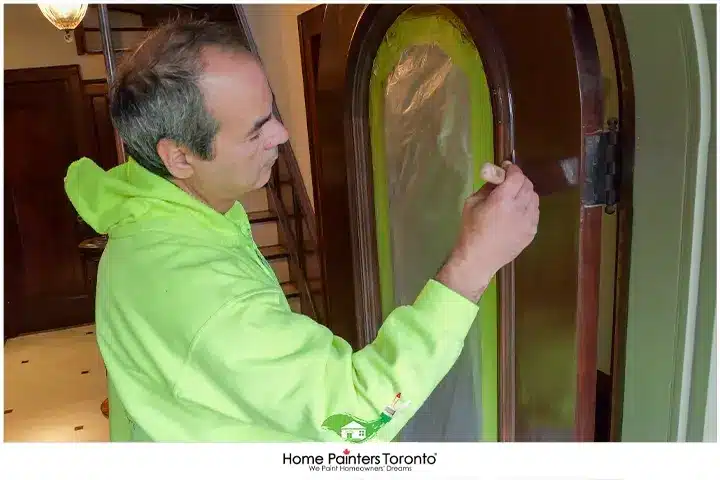 Painter Painting a Door