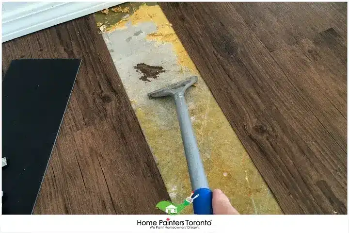 Painter Repairing Vinyl Flooring