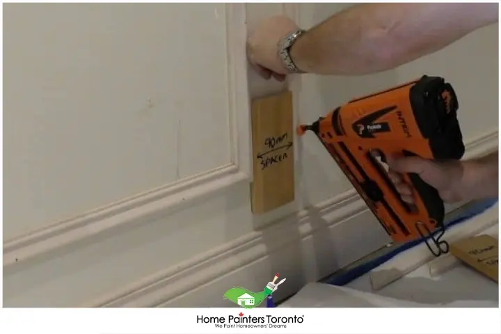 painter repairing wainscoting 1