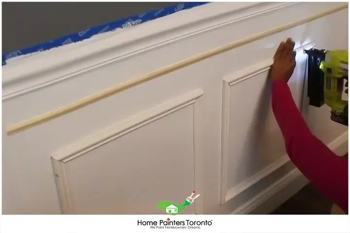 painter repairing wainscoting 2